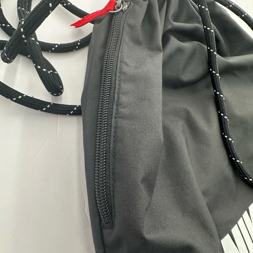 Nike Black Drawstring Sports Sack with White Logo and Red Accent